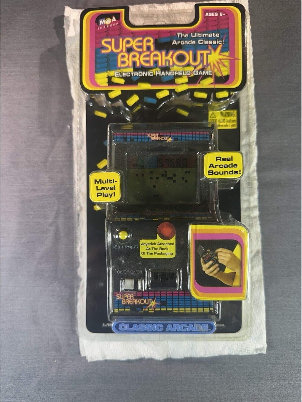 Super Breakout Electronic Handheld Game by MGA Entertainment